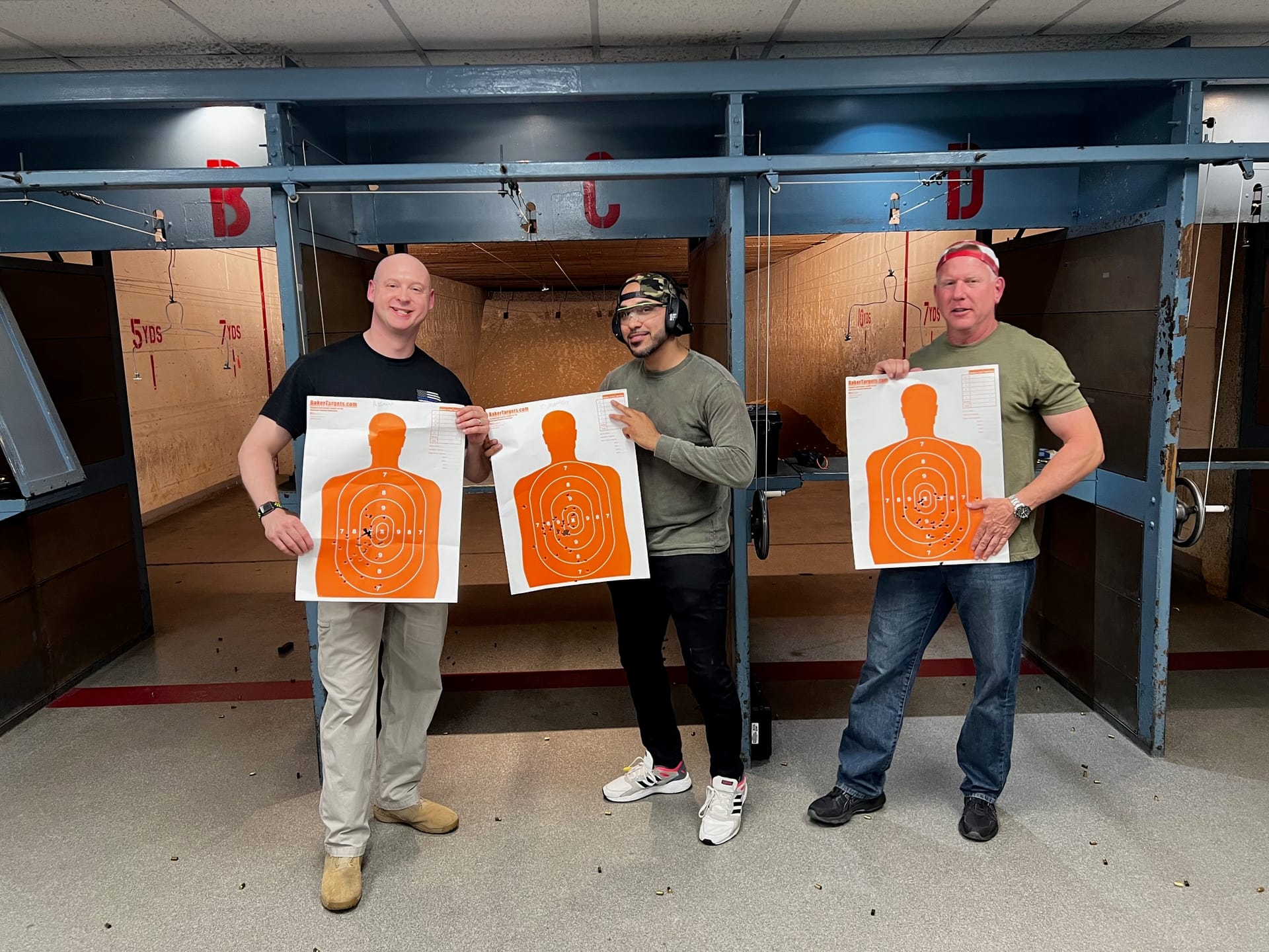 Students displaying target results at the firing range