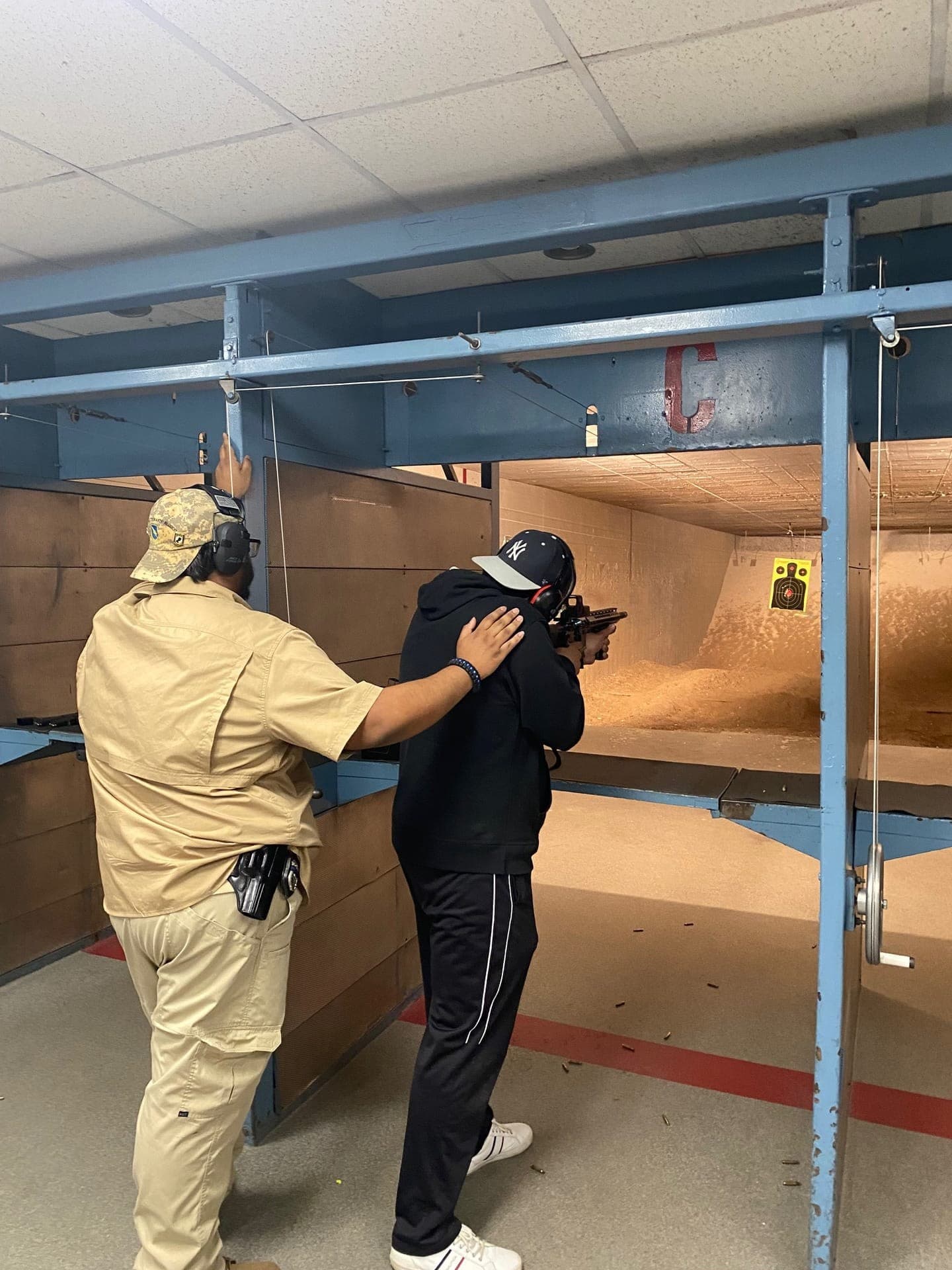 Live fire exercise — guiding student at shooting position